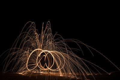 Light trails against sky at night