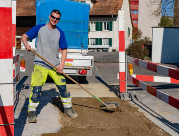 Portrait of smiling worker working at road