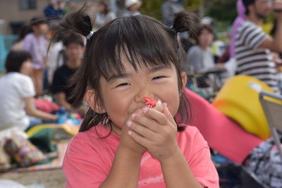 Close-up portrait of happy girl outdoors