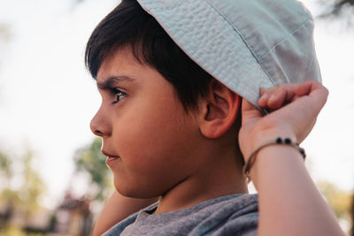 Close-up portrait of boy looking away