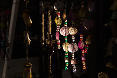 Close-up of illuminated lanterns hanging at store