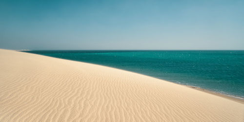 Scenic view of sea against clear sky