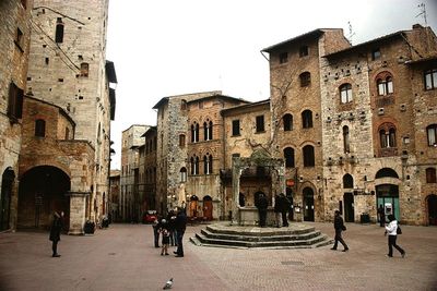 People at town square against clear sky