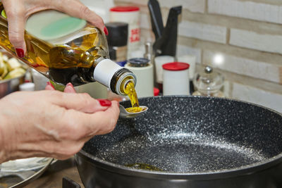 Close-up of person hand working in kitchen