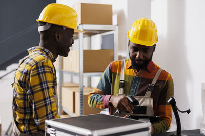 Rear view of engineer working at construction site