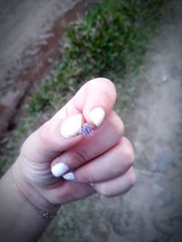Close-up of person holding hands
