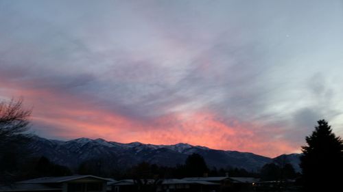 Scenic view of mountains against cloudy sky