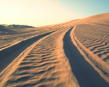 Scenic view of desert against clear sky