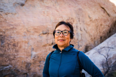 Portrait of senior asian woman in the desert landscape