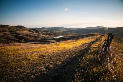 Scenic view of landscape against sky during sunset