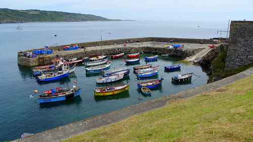 High angle view of boats moored on sea against sky
