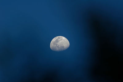 Low angle view of moon against clear sky