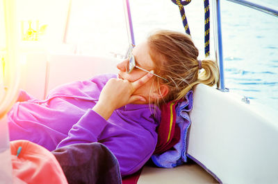 Young woman relaxing in boat