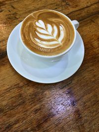 High angle view of cappuccino on table