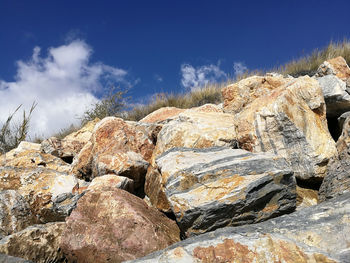 Low angle view of rock formation against sky