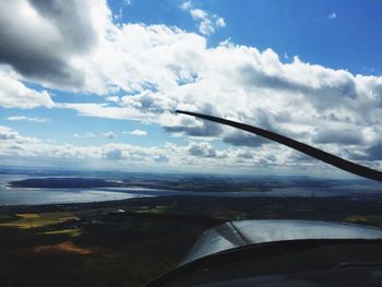 Cropped image of airplane over landscape