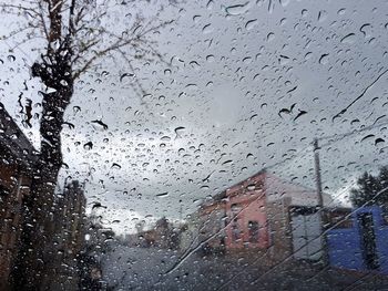 Full frame shot of wet glass window in rainy season