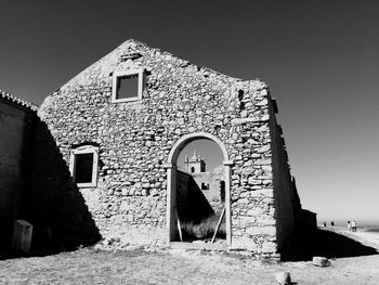 Low angle view of old building against clear sky