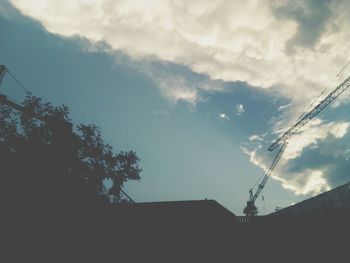 Low angle view of building against cloudy sky