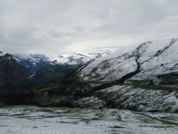 Scenic view of mountains against sky during winter