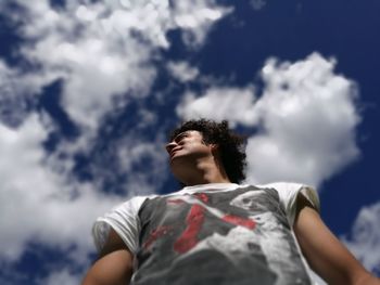 Low angle view of woman against sky