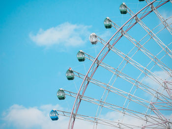 Low angle view of ferris wheel against sky