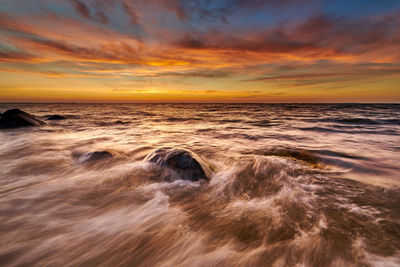 Scenic view of sea against sky during sunset