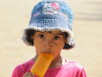 Portrait of girl having popsicle
