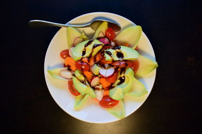 High angle view of fruits in plate on table