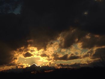 Low angle view of cloudy sky at sunset