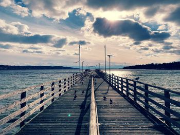 Pier over sea against sky