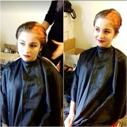 Portrait of beautiful young woman standing in mirror