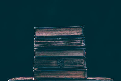 Close-up of stack of books on table