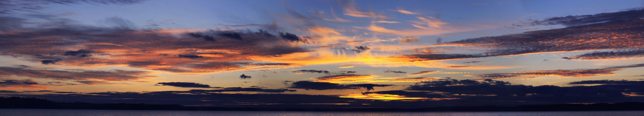 Scenic view of dramatic sky over lake