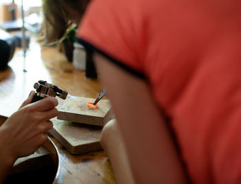 Close-up of man working on cutting board