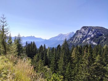 Scenic view of mountains against clear blue sky