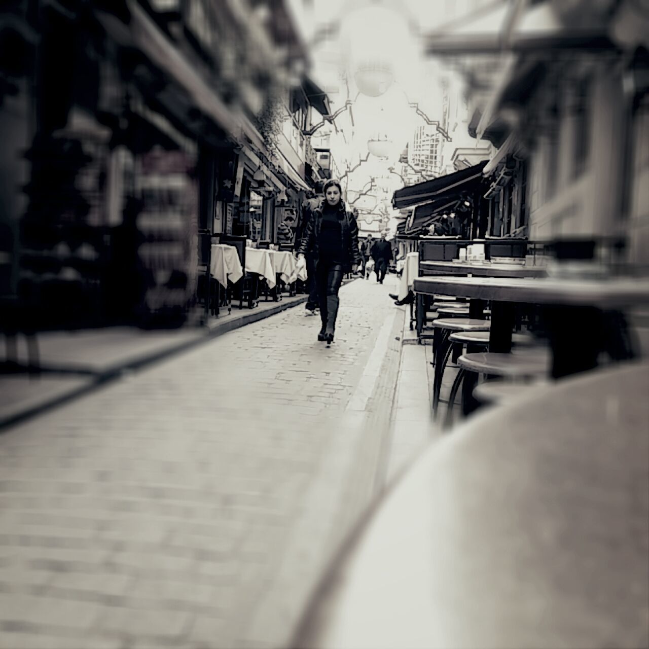 architecture, building exterior, built structure, selective focus, men, lifestyles, street, focus on foreground, leisure activity, walking, incidental people, full length, person, bicycle, city, rear view, transportation, outdoors