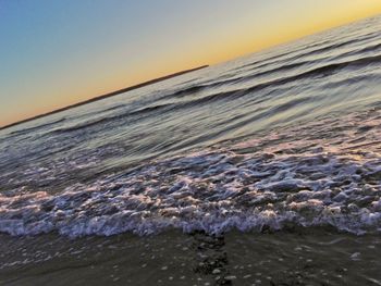 Scenic view of calm sea at sunset