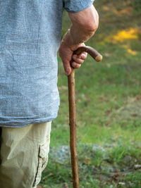 Midsection of man holding hands