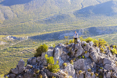 Scenic view of land against mountain range