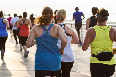 Rear view of people running