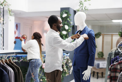 Rear view of doctor examining patient in laboratory