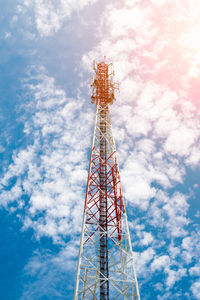 Low angle view of communications tower against sky