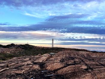 Scenic view of landscape against cloudy sky