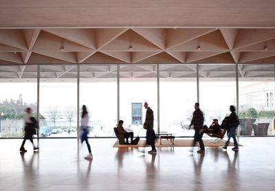 Group of people walking in corridor