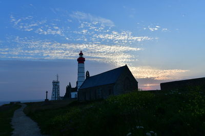 Traditional building against sky during sunset