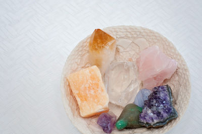 High angle view of candies in plate on table