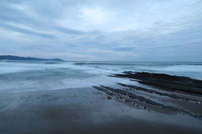 Scenic view of beach against sky
