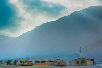 A small fishing cove with very poor houses on the coast of the atacama desert in northern chile