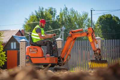 Rear view of man working on field